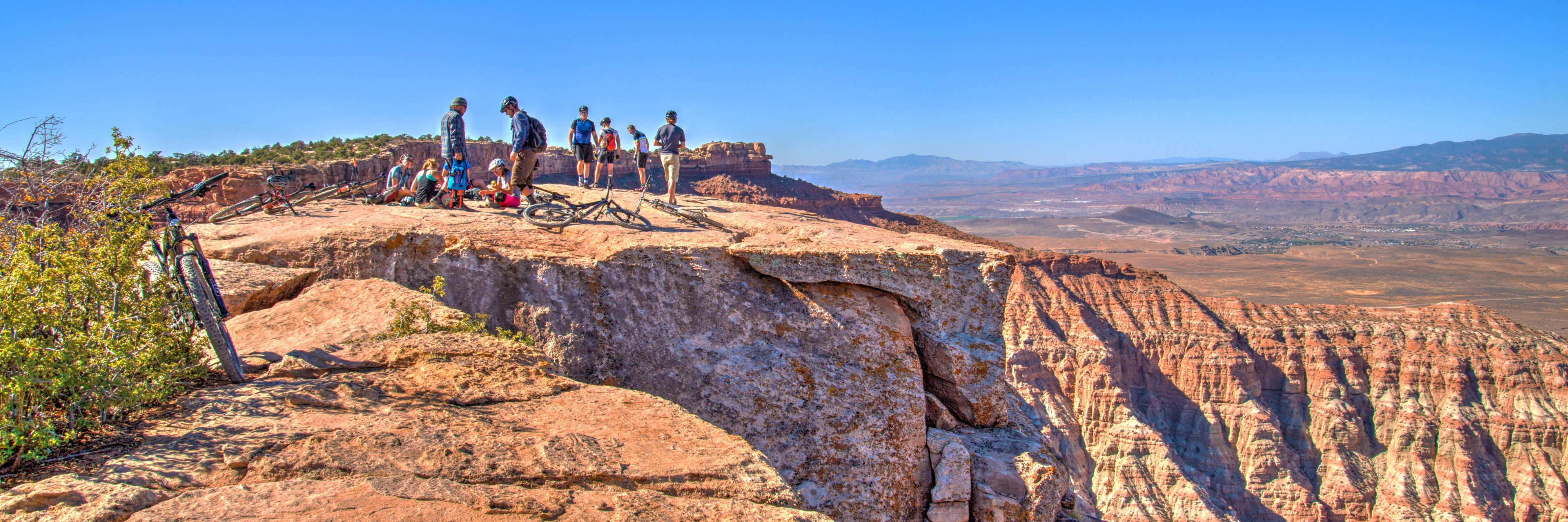 Mountain bike riders regroup at the South Point lunch spot on Gooseberry Mesa during guided tour