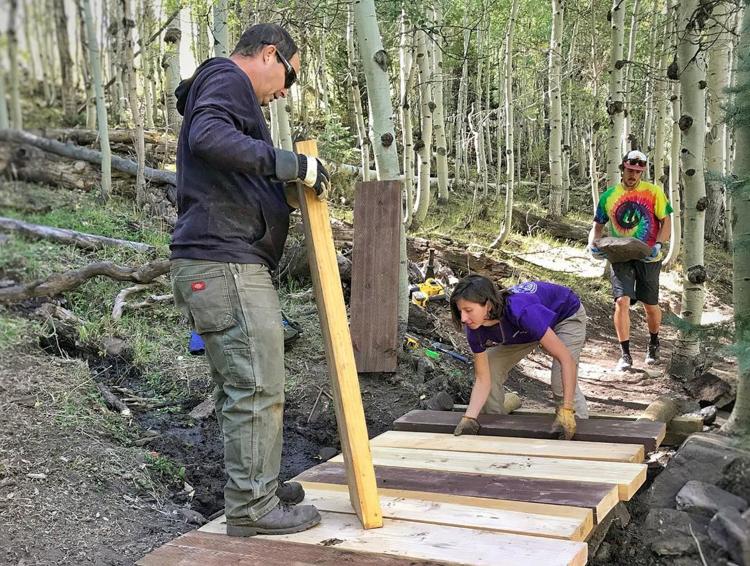 Trail Mix volunteers at work on an upper section of The Whole Enchilada Trail