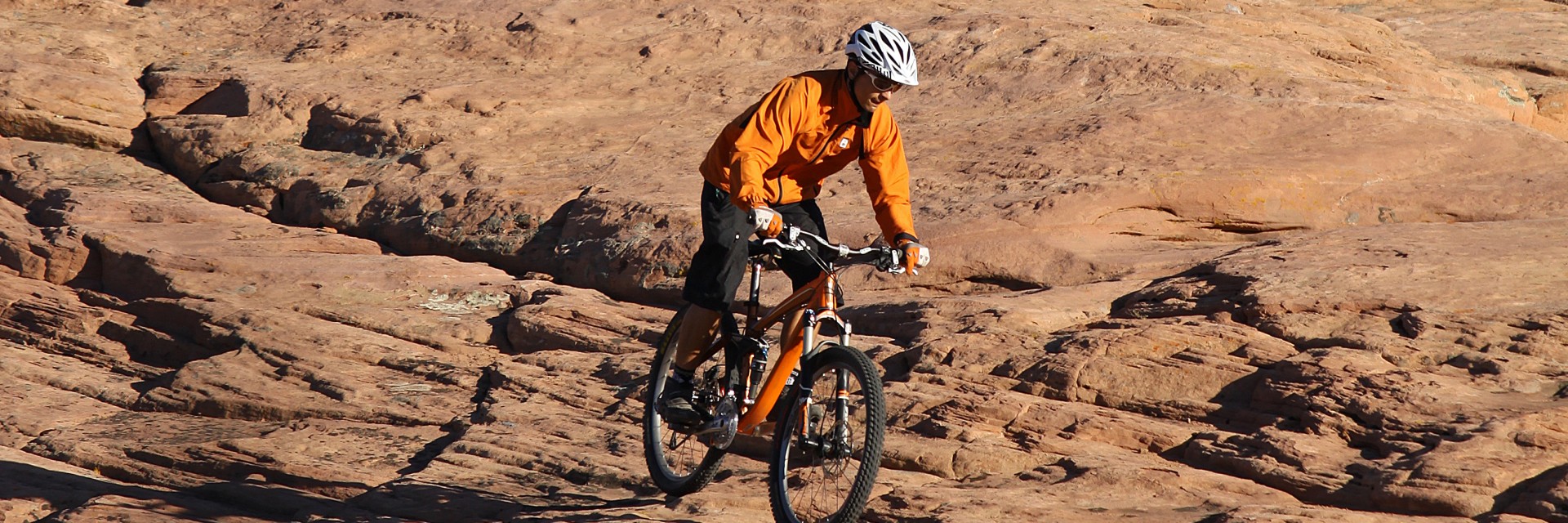 Riding Porcupine Rim with stunning desert vistas